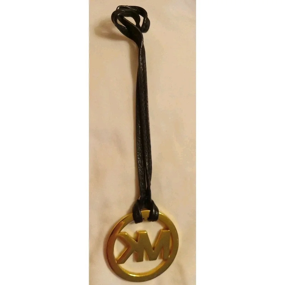 Michael Kors Gold Tone MK Logo Charm Hang Tag Luggage color Leather Strap
